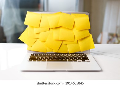 Busy Office Working Lifestyle Concept With Laptop Screen Covered By Yellow Sticky Notes.