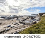 The busy Port of Dover, in the United Kingdom, loading and unloading all kinds of road vehicles. Ferries and boats coming and going to France.