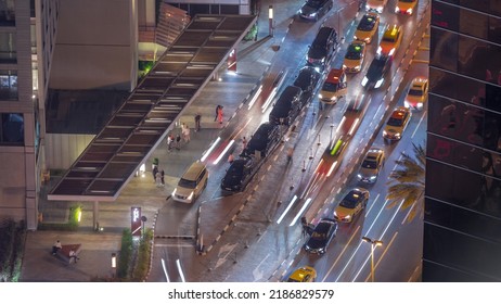 Busy Road Traffic Aerial Night Timelapse In Financial District And Modern Skyscrapers Around In Luxury Dubai City, United Arab Emirates