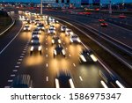 Busy rush hour traffic leaves light trails on the A9 highway near Amsterdam, Schiphol to Haarlem.