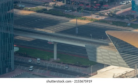 Busy Sheikh Zayed Road Traffic Aerial Timelapse, Metro Railway And Modern Skyscrapers Around In Luxury Dubai City, United Arab Emirates