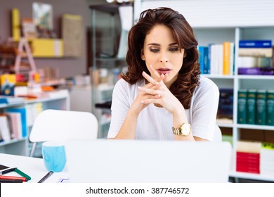 Busy Small Business Owner Working Looking Worried At Laptop Screen