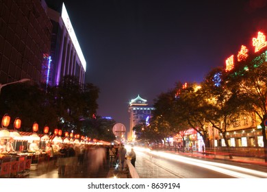 Busy Street In Beijing With People At The Nighttime Food Markets