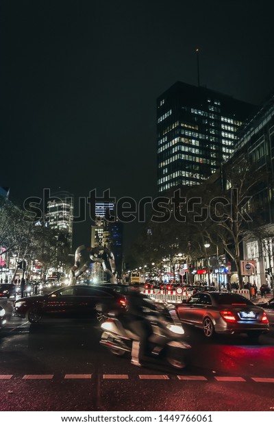 Busy street in\
downtowm of Berlin at night. Night urban cityscape in Berlin.\
Berlin night life concept.
