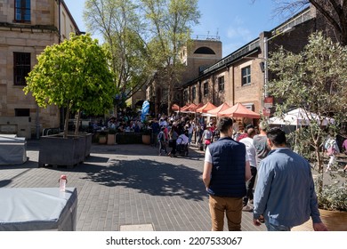 Busy Street Market At The Rocks In Sydney Central Business District On 18 September 2022. Stalls At Street Market In Downtown Australia. Crowded Shopping Area And Buildings.