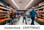 A busy supermarket aisle with blurred shoppers pushing carts, indicating a typical day of grocery shopping in a well-stocked store