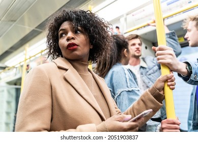 Busy Tube, People Commuting, Black Woman Holding Phone - Multiracial Group Of People Together In Subway Metro Train In London - Travel, Lifestyle And Commuting In Millennials Life