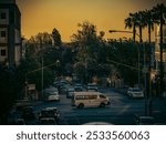 A busy urban intersection at sunset with cars and traffic lights in Johannesburg, South Africa