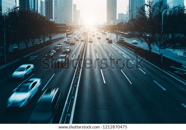 Busy urban traffic on the urban expressways of\
Beijing, China.