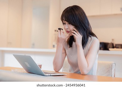 Busy woman eating dinner while teleworking - Powered by Shutterstock