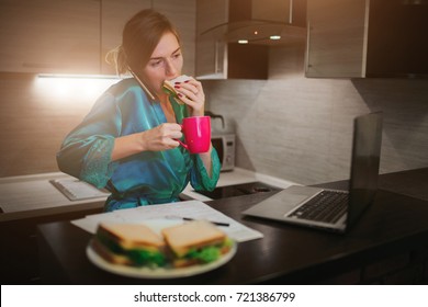 Busy Woman Eating, Drinking Coffee, Talking On The Phone, Working On Laptop At The Same Time. Businesswoman Doing Multiple Tasks. Multitasking Business Person. Freelancer Works At Night.