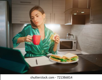 Busy Woman Eating, Drinking Coffee, Talking On The Phone, Working On Tablet At The Same Time. Businesswoman Doing Multiple Tasks. Multitasking Business Person. Freelancer Works At Night.