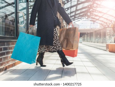 Busy Woman Walking With Shopping Bags Outside. Alone At Crosswalk. Stylish Fabulous Person. Daylight. Shopaholic In Mall