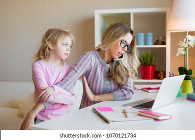 Busy working mother doesn't have time for her kid - Shutterstock ID 1070121734