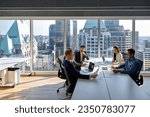 Busy young professional international board executives, diverse team people group discussing financial results managing company project working together in modern meeting room.