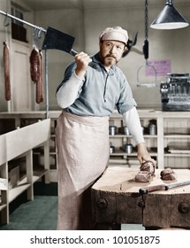 Butcher Chopping Meat With Cleaver