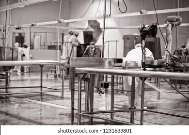 Butcher cleaning the floor at meat factory - Powered by Shutterstock