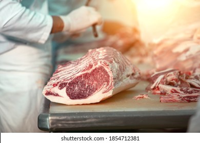 Butcher Cutting Wagyu Beef In The Slaughterhouse