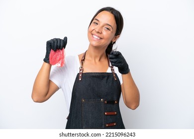 Butcher Hispanic Woman Wearing An Apron And Serving Fresh Cut Meat Isolated On White Background Pointing Front With Happy Expression