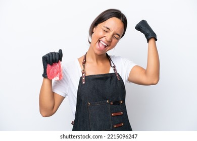 Butcher hispanic woman wearing an apron and serving fresh cut meat isolated on white background celebrating a victory - Powered by Shutterstock