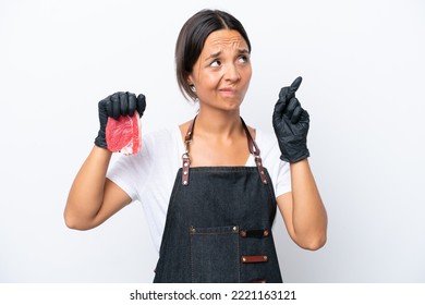 Butcher Hispanic Woman Wearing An Apron And Serving Fresh Cut Meat Isolated On White Background With Fingers Crossing And Wishing The Best