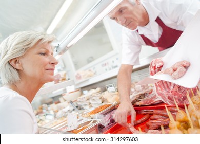 Butcher serving a senior customer - Powered by Shutterstock