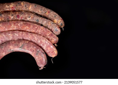 Butcher Shop - Charcuterie Spiced Artisan Raw Sausages On Black Background