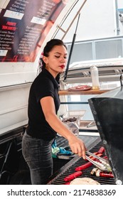 Butcher Shop Owner Works Hard Grilling Meat For Customers.