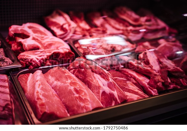 Butcher shop\'s meat window with\
meat packs. Different products in meat market. Meat\
counter.