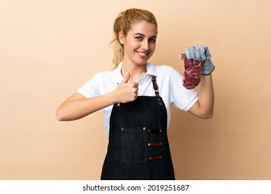 Butcher Woman Wearing An Apron And Serving Fresh Cut Meat Over Isolated Background Giving A Thumbs Up Gesture