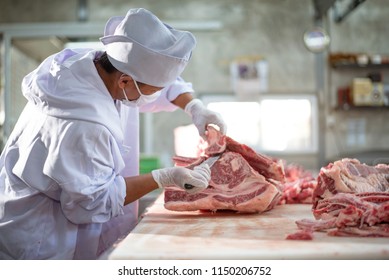 Butcher working in meat industry factory good product of food