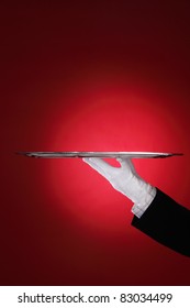 Butler Carrying Silver Serving Tray, Close-up Of Hand