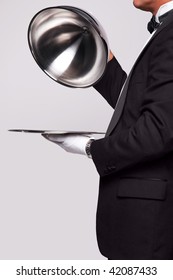 Butler Lifting The Cloche From A Silver Serving Tray, Insert Your Own Object Onto The Tray.