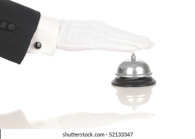 Butler's gloved hand extended over service bell isolated on white. Hand and arm only in horizontal format with reflections.