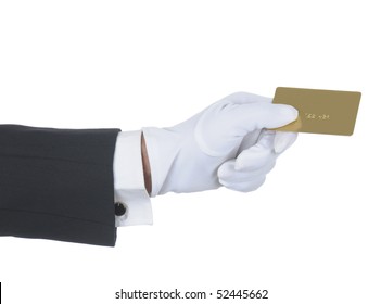 Butler's gloved hand holding up a gold credit card isolated over white. Hand and arm only in horizontal format.