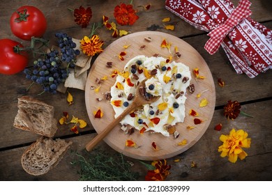 Butter board food trend, butter spread on wooden board with sweet toppings of honey and pecans - Shutterstock ID 2210839999