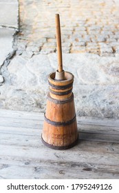 Butter churn - old traditional wooden plunger-type butter churn with staff - Shutterstock ID 1795249126