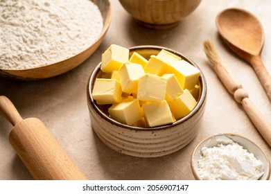 Butter cubes and baking ingredients flour, butter, spices, eggs, sugar. - Powered by Shutterstock