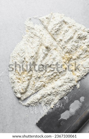 butter and flour being mixed together, butter and flour mixed into rough pastry, butter and flour being used to make scones, process of making scones