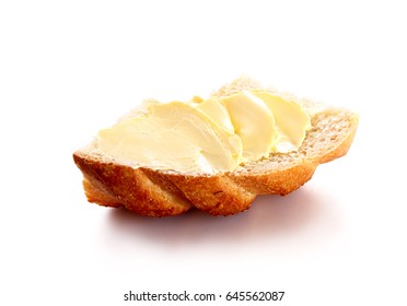 butter on bread isolated white background 