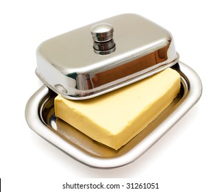 Butter On Silver Butter Dish Isolated On White Background