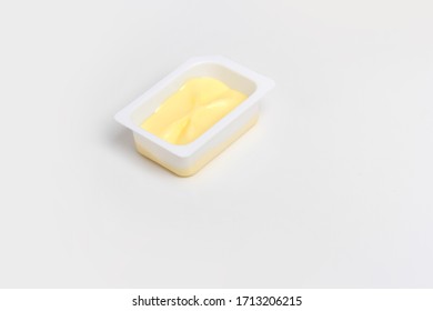 Butter In A Plastic Box On The Table. The View From The Top