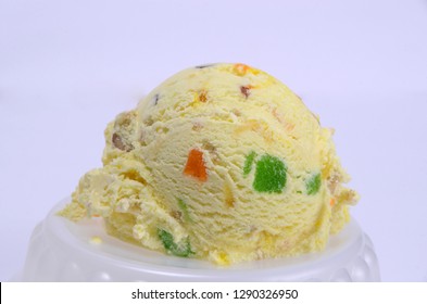 Butter Scotch Ice Cream With Cherry And Dry Fruits In Plate