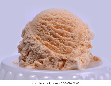 Butter Scotch Ice Cream With Cherry And Dry Fruits In Pliate