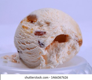 Butter Scotch Ice Cream With Cherry And Dry Fruits In Pliate