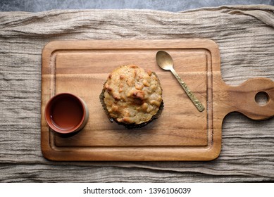 Butter Scotch On A Wooden Plate And Stone Background