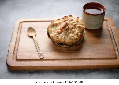 Butter Scotch On A Wooden Plate And Stone Background