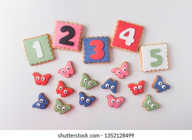 butterflies and numbers from 1 to 5 in cookie. Colors of spring. Gift to celebrate a children's birthday. Snack.