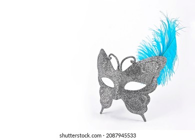 butterfly mask with silver diamond and blue feather, isolated on white background with space for text