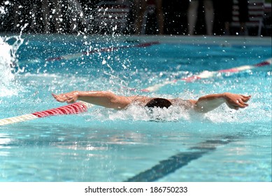 Butterfly swimmer during a swim meet
